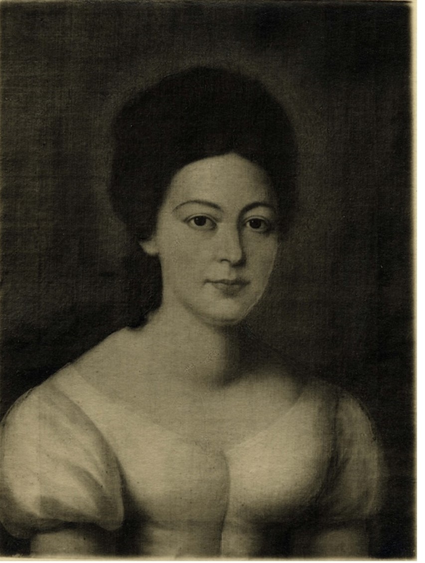 zdjęcie w sepii przedstawiające kobietę o ciemnych włosach, w białej sukni