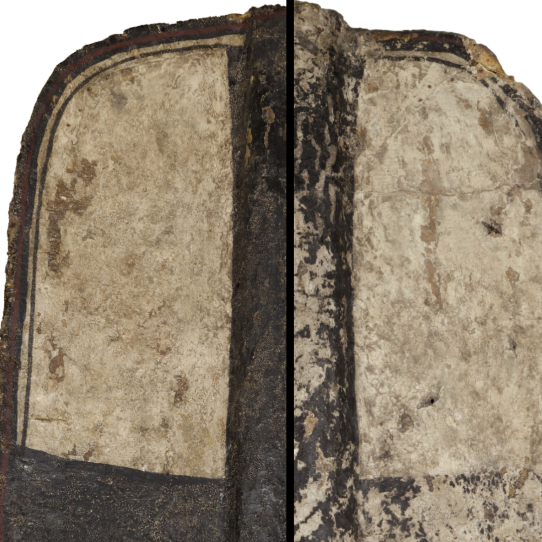 Zbliżenie przedniej strony tarczy rycerskiej, przedstawiające detale malarskie oraz wyraźny krzyż na środku. Ślady starzenia i zużycia są wyraźnie widoczne.